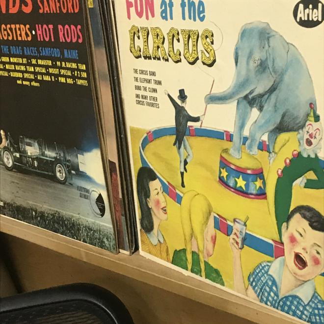 a sleeve for a vinyl record that says fun at the circus and shows children at a circus in a 50s illustrative style
