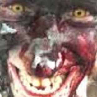 a zoomed in low quality photo of connor o'malley, a white man with neon yellow eyes, he's grinning deviously and his face is covered entirely in blood